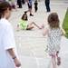 Ann Arbor resident Callie Hastie, 12, drawls with chalk as others jump on hop scotch on Friday, June 21. Daniel Brenner I AnnArbor.com